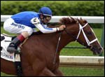 John R. Velazquez, aboard Maddalena, rides to win the first race at Churchill Downs