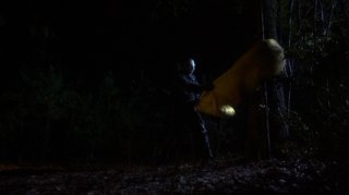 Jason kills a girl in a sleeping bag by slamming it against a tree